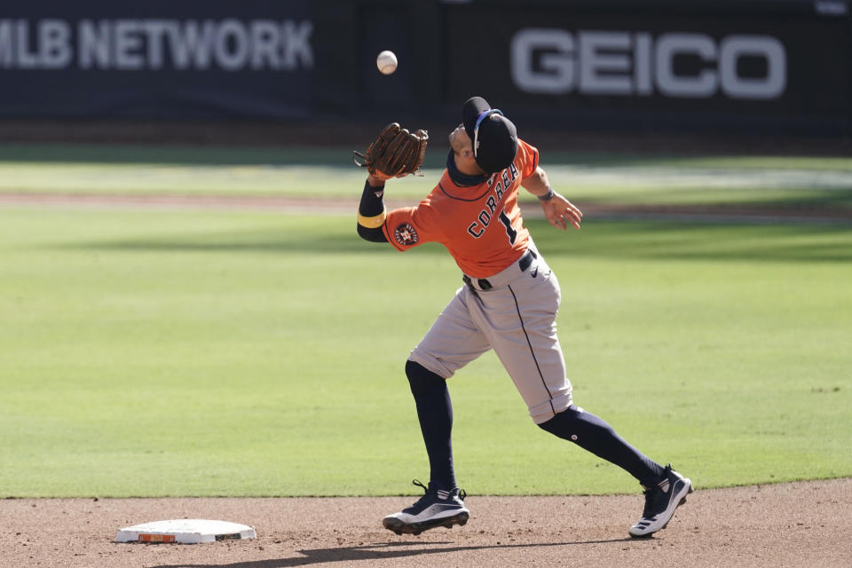 Houston Astros shortstop Carlos Correa catches a fly ball by Tampa Bay Rays Mike Zunino during the four inning in Game 2 of a baseball American League Championship Series, Monday, Oct. 12, 2020, in San Diego. (AP Photo/Jae C. Hong)