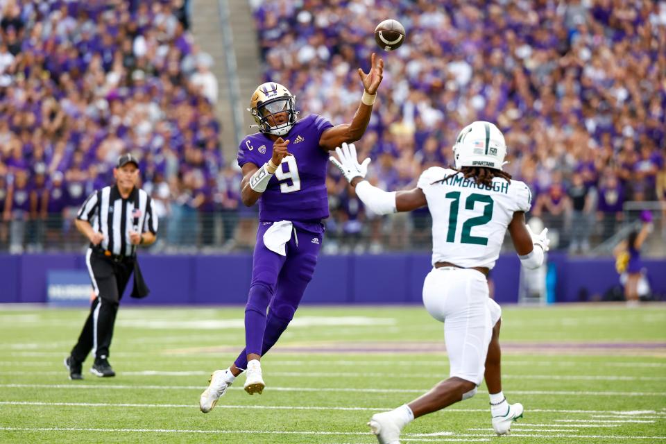 Washington quarterback Michael Penix Jr. (9) throws a touchdown pass against Michigan State during the second quarter at Alaska Airlines Field at Husky Stadium.