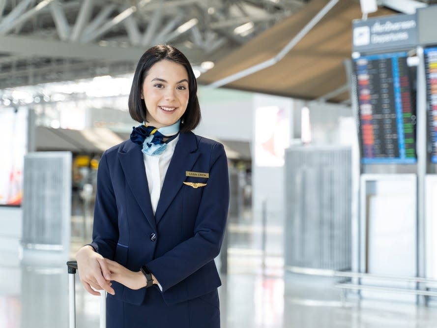 A flight attendant at an airport