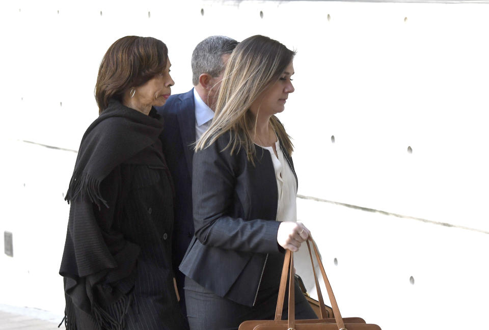 Former Baltimore mayor Catherine Pugh, left, arrives at U.S. District Court in Baltimore on Thursday, Nov. 21, 2019. Pugh was charged Wednesday with fraud and tax evasion involving sales of her self-published children's books to non-profits and foundations that did business with the government. (AP Photo/Steve Ruark)