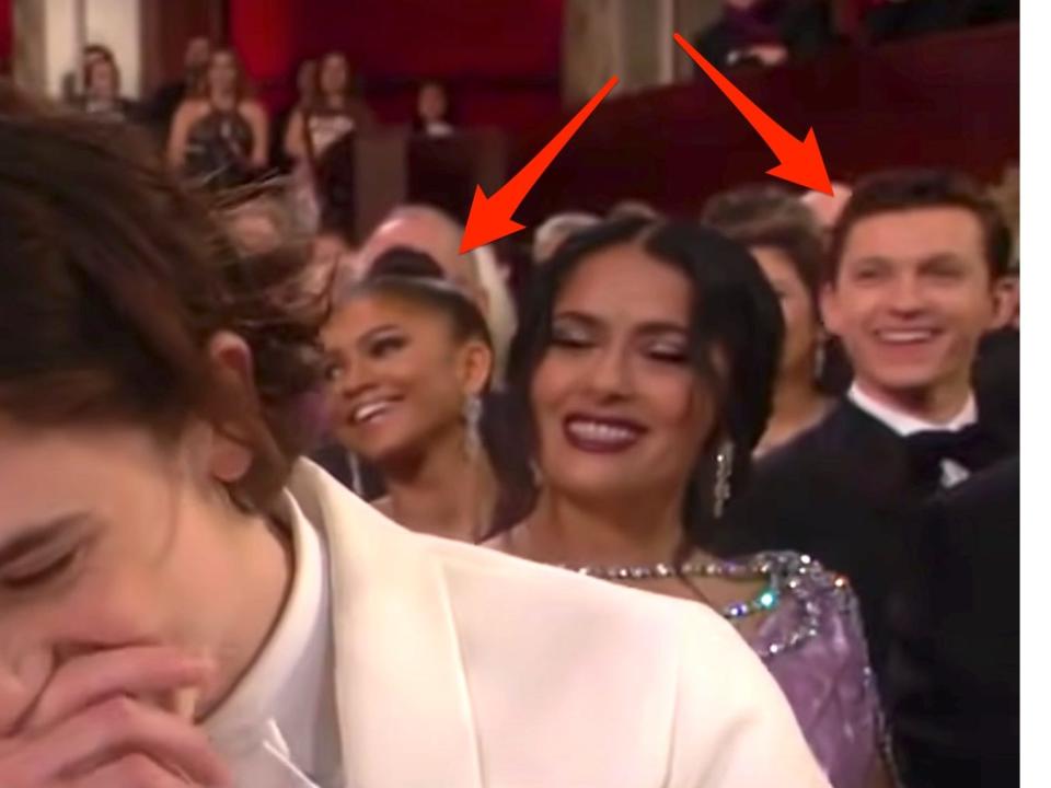 Arrows pointed at Zendaya and Tom Holland sitting together at the 2018 Oscars.