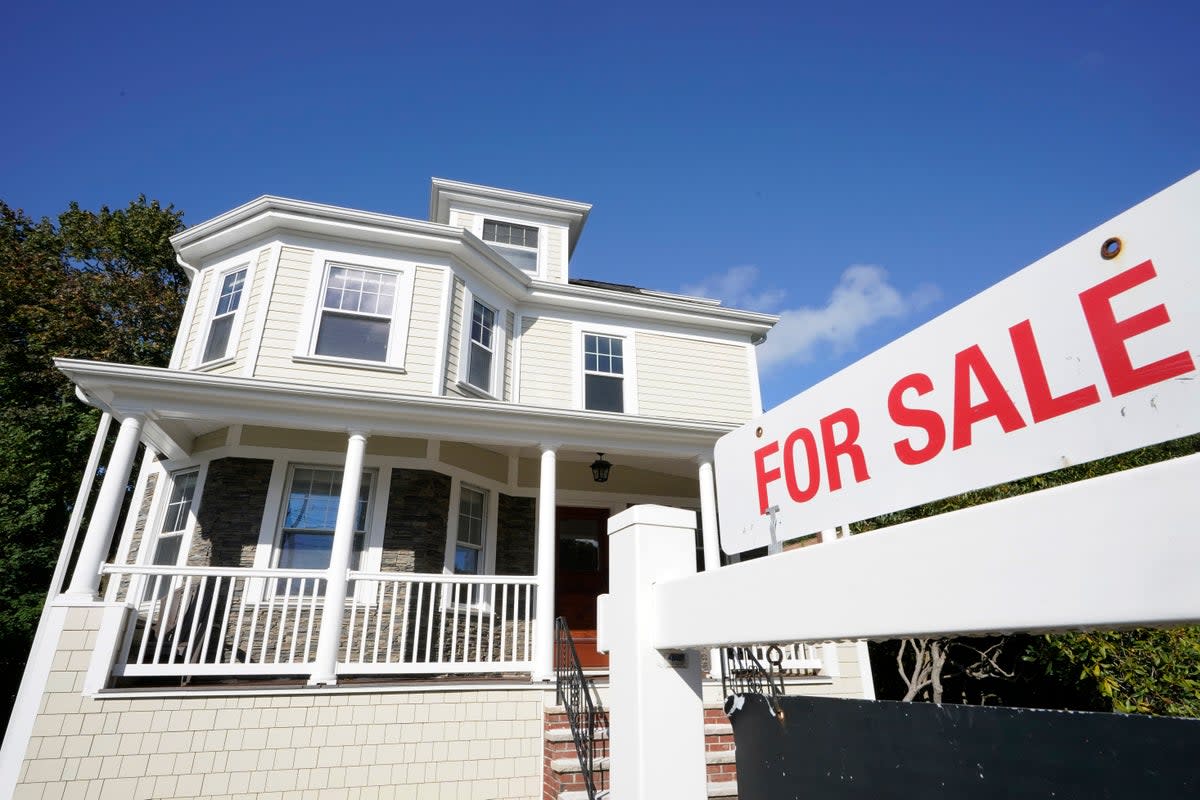 A for sale sign stands in front of a house, on Oct. 6, 2020, in Westwood, Mass.  (Copyright 2020 The Associated Press. All rights reserved)