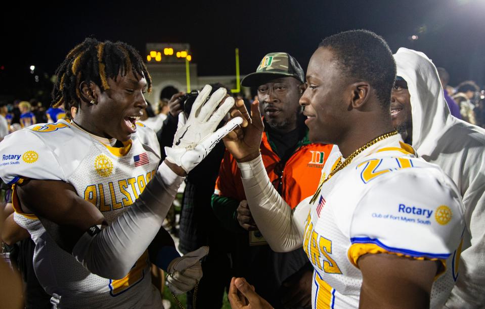 Eric Fletcher, left, and Kelby Tyre of Gold Team were co MVPÕs in the Rotary South All Star game at Fort Myers High School on Wednesday, Dec. 13, 2023. The Gold team won in a thriller.