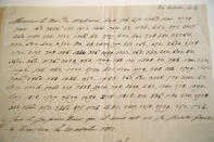 In this photo taken Wednesday, Nov. 28, 2012, a letter dictated by Napoleon in secret code that declares his intentions "to blow up the Kremlin" during his ill-fated Russian campaign is displayed in Fontainebleau, outside Paris. The rare letter, written in unusually emotive language, sees Napoleon complain of harsh conditions and the shortcomings of his grand army. The letter goes on auction Sunday, Dec. 2, 2012. (AP Photo/Christophe Ena)