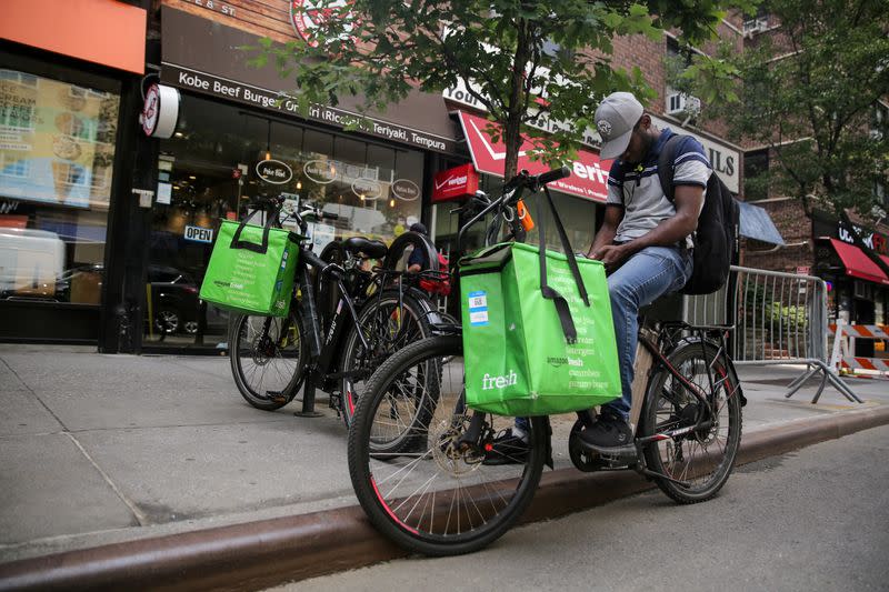 FILE PHOTO: Delivery man takes break in New York