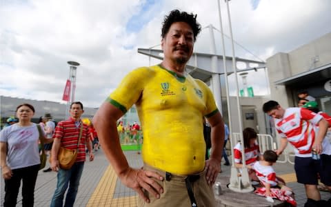 A supporter with his body painted in Australian colors stands prior to the Rugby World Cup Pool D game at Tokyo Stadium between Australia and Wales in Tokyo, Japan, Sunday, Sept. 29, 2019 - Credit: &nbsp;AP