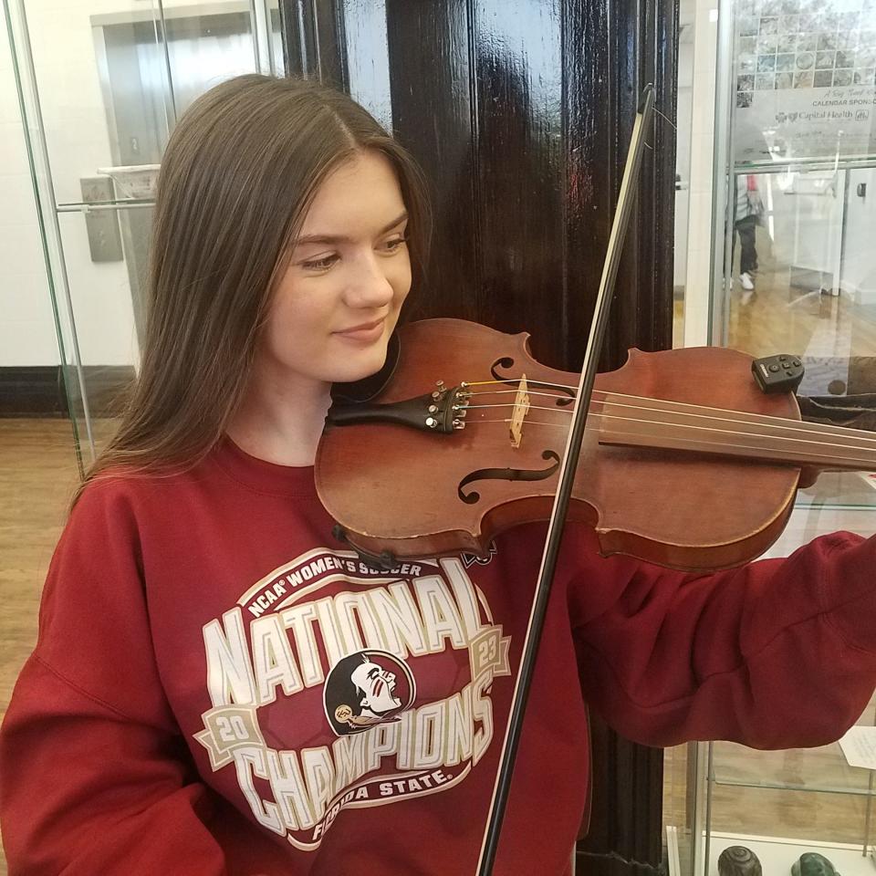 Katy Hill, 15, demonstrates her fiddle playing at the Tallahassee Senior Center on Jan. 18, 2024.