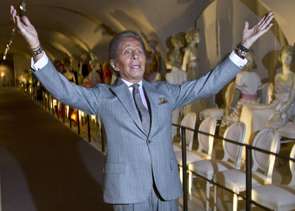 Italian designer Valentino poses for photographers during the 'Valentino: Master of Couture' Photocall at Somerset House in central London, Wednesday Nov. 28, 2012. Celebrating a 50-year career, the exhibition showcases over 130 hand-crafted designs worn by Grace Kelly, Sophia Loren and Gwyneth Paltrow. (Photo by Joel Ryan/Invision/AP)