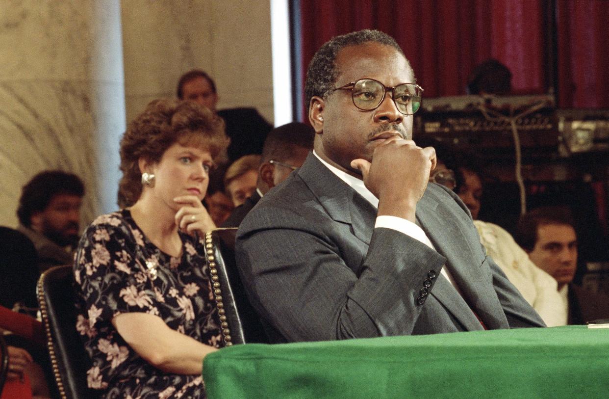Then-Supreme Court Justice Nominee Clarence Thomas and his wife Virginia listen during his nomination hearing before the Senate Judiciary Committee on Capitol Hill in Washington in this file photo from 1991.