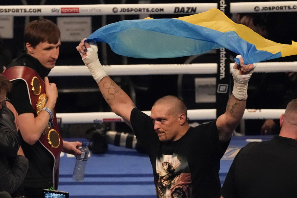 Oleksandr Usyk of Ukraine celebrates after his unanimous decision victory over Anthony Joshua of Britain in their WBA (Super), WBO and IBF boxing title bout at the Tottenham Hotspur Stadium in London, Saturday, Sept. 25, 2021. (AP Photo/Frank Augstein)