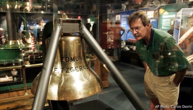Tom Fischer of Evansville, Ind. looks over the Edmund Fitzgerald bell on display at the Great Lakes Shipwreck Museum in Whitefish Point, Mich., June 29, 2005. (AP file)