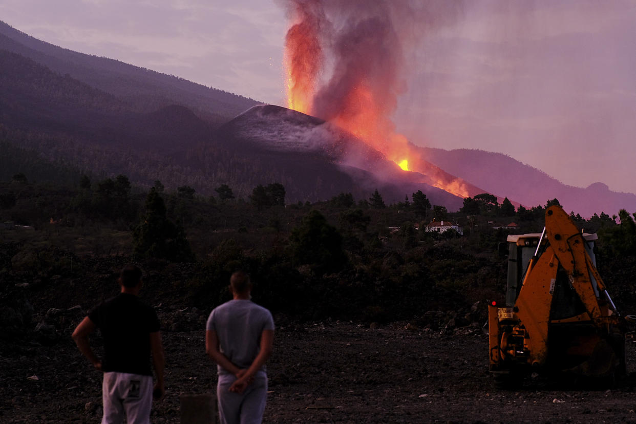 Lava flows from a volcano on the Canary island of La Palma, Spain on Friday Oct. 1, 2021. An erupting volcano on a Spanish island off northwest Africa has blown open another fissure on its hillside. Authorities were watching Friday to see whether lava from the new fissure would join the main flow that has reached the sea. The new fissure is the third to crack open since the Cumbre Vieja crater erupted on La Palma island Sept. 19. (AP Photo/Daniel Roca)