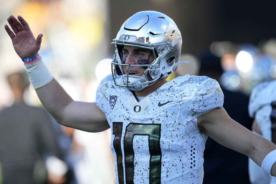 Oregon quarterback Bo Nix (10) celebrates a touchdown against Arizona State during the first half on an NCAA college football game, Saturday, Nov. 18, 2023, in Tempe, Ariz. (AP Photo/Matt York)