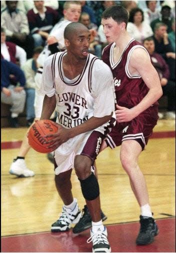 Kobe Bryant (33) of Lower Merion (Pennsylvania) High School is guarded by Stroudsburg High School's Emmet Donnelly during a PIAA Class 4A quarterfinal game at Martz Hall in Pottsville, Pennsylvania, in 1996. Bryant died Sunday, Jan. 26, 2020, in a helicopter crash in California at age 41.