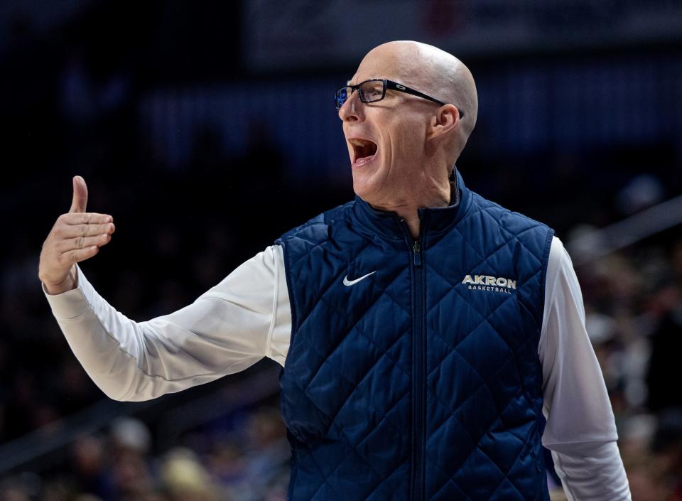 Akron coach John Groce shouts to the team during the first half against James Madison on Feb. 10 in Harrisonburg, Va.