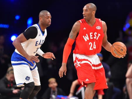 Feb 14, 2016; Toronto, Ontario, CAN; Western Conference forward Kobe Bryant of the Los Angeles Lakers (24) controls the ball against Eastern Conference guard Dwyane Wade of the Miami Heat (3) in the second half during the NBA All Star Game at Air Canada Centre. Mandatory Credit: Bob Donnan-USA TODAY Sports