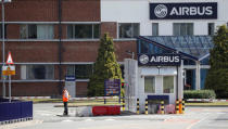 A security guard stands at the entrance to Airbus' wing assembly plant at Broughton, near Chester, Britain, June 22, 2018. REUTERS/Phil Noble
