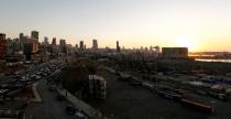 A view shows the damaged port area in the aftermath of a massive explosion at sunset in Beirut