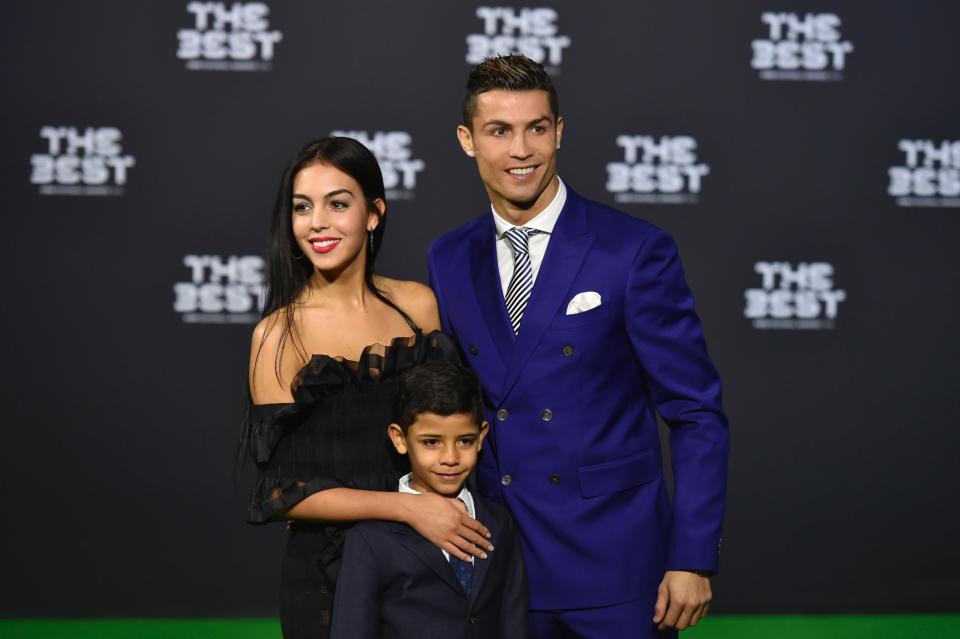 Family: Rodriguez and Ronaldo with the footballer's eldest son Cristiano Jr (MICHAEL BUHOLZER/AFP/Getty Images)