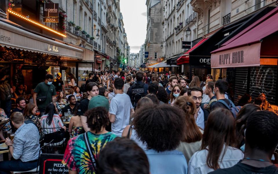 People celebrate the French midsummer Festival of Music in Paris, after the government lifted curfew restrictions early, on 21 June 2021 - Rafael Yaghobzadeh/Getty Images