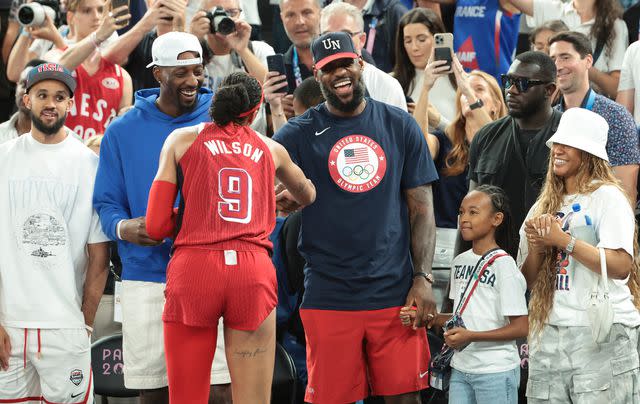 <p>Jean Catuffe/Getty</p> LeBron James congratulates A'ja Wilson.