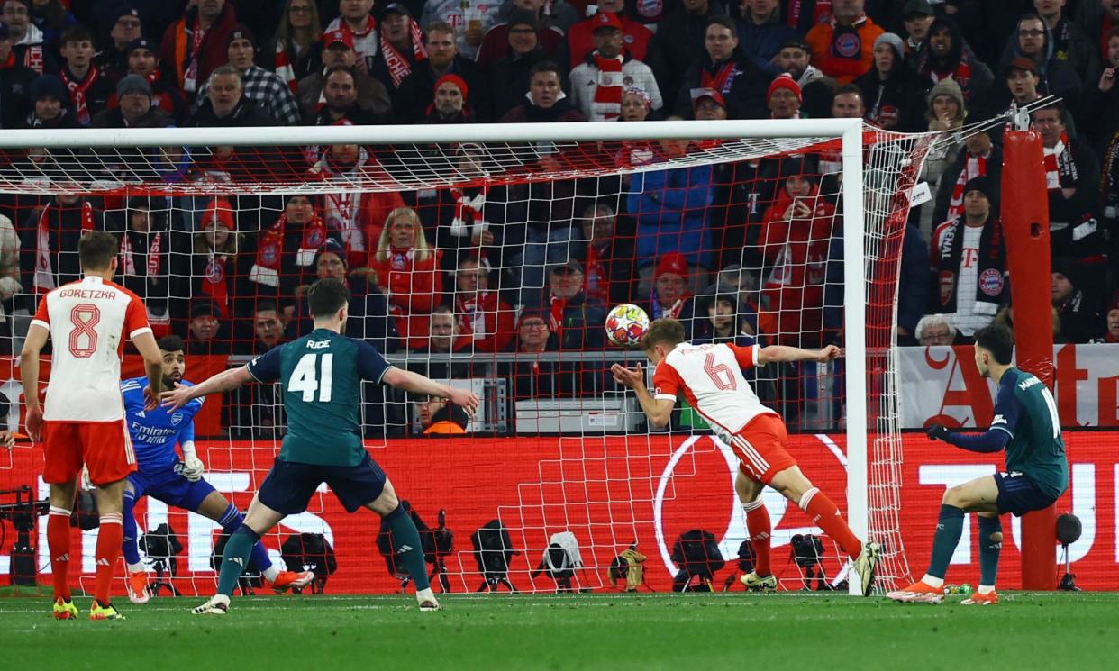 <span>Joshua Kimmich flies in to head past David Raya and win the tie for Bayern.</span><span>Photograph: Kai Pfaffenbach/Reuters</span>