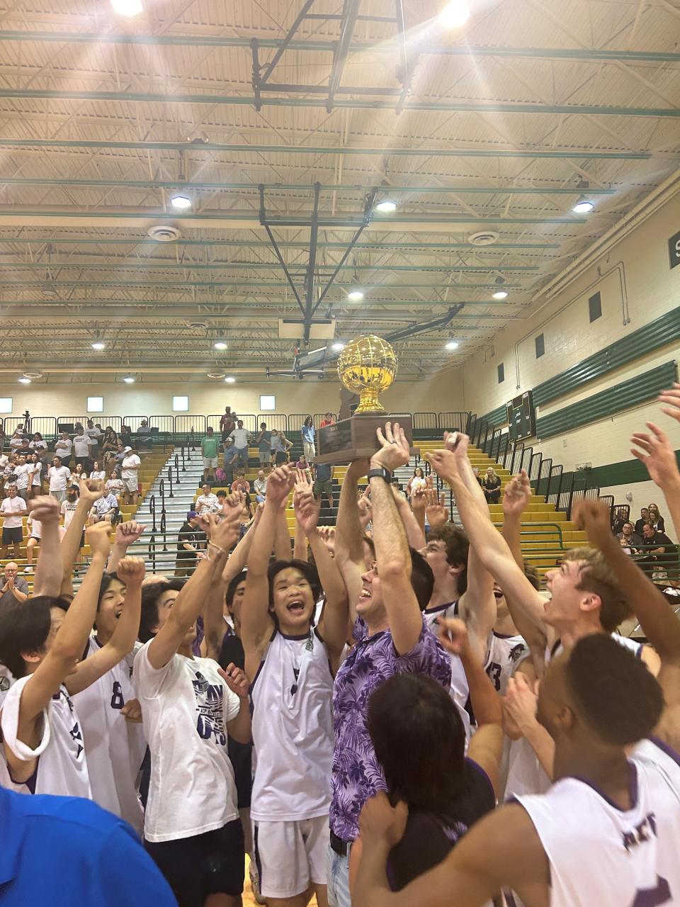 AZ College Prep celebrating 4A title trophy after defeating Northwest Christian.