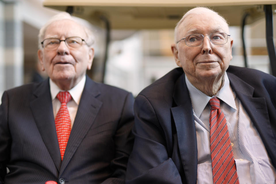 Vice Chairman Charlie Munger, right, sits next to Berkshire Hathaway Chairman and CEO Warren Buffett, as they briefly chat with reporters Friday, May 3, 2019, one day before Berkshire Hathaway's annual shareholders meeting. An estimated 40,000 people are expected in town for the event, where Buffett and Munger preside over the meeting and spend hours answering questions. (AP Photo/Nati Harnik)