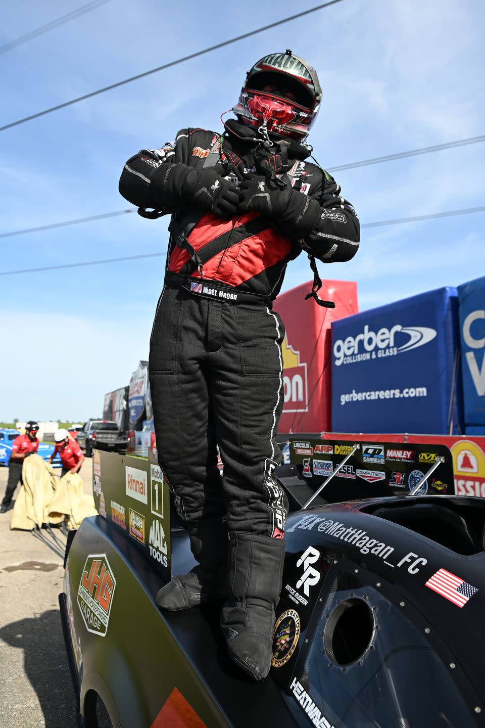 a person wearing a helmet and riding a go kart