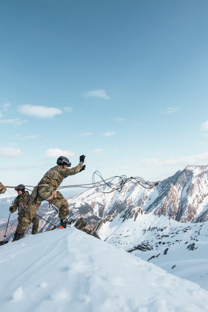 <span class="article__caption">LT Jake Remick (RI) throws the rappel line over the edge on the Kitzsteinhorn glacier.</span> (Photo: Max Archambault)