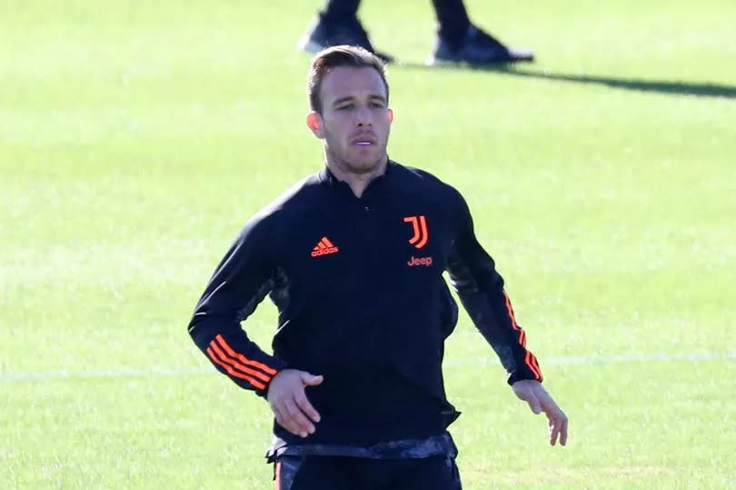 Arthur Melo warms up during a Juventus training session.