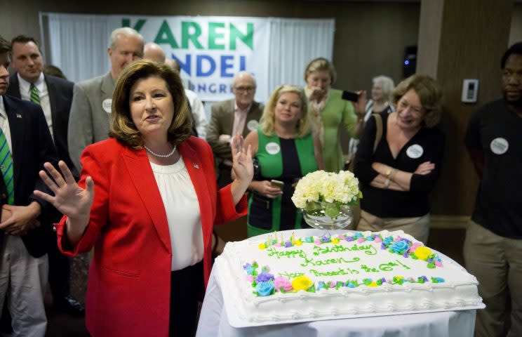 Republican candidate for Georgia’s Sixth Congressional seat Karen Handel, left, is presented with a cake as her birthday is celebrated at an election night watch party in Roswell, Ga., Tuesday, April 18, 2017. (Photo: David Goldman/AP)