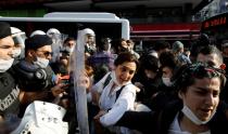 Protesters scuffle with riot police during a protest in Istanbul