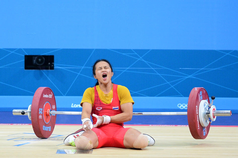 LONDON, ENGLAND - JULY 28: Panida Khamsri of Thailand reacts in the Women's 48kg Group A weightlifting on Day 1 of the London 2012 Olympic Games at ExCeL on July 28, 2012 in London, England. (Photo by Laurence Griffiths/Getty Images)