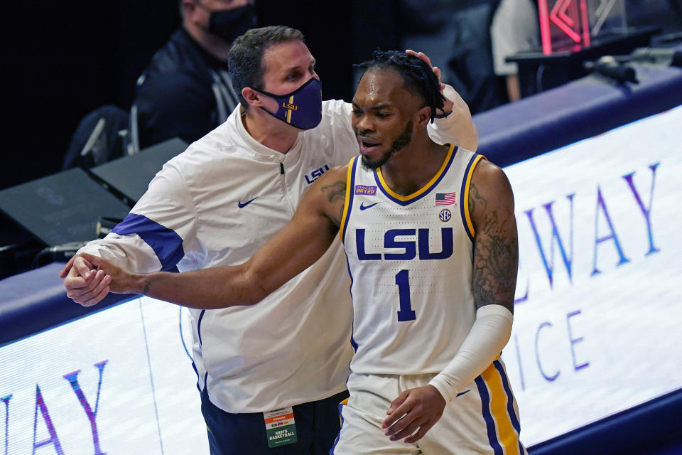 LSU head coach Will Wade congratulates guard Ja'Vonte Smart (1) during a substitution in the second half of an NCAA college basketball game against Tennessee in Baton Rouge, La., Saturday, Feb. 13, 2021. (AP Photo/Gerald Herbert)