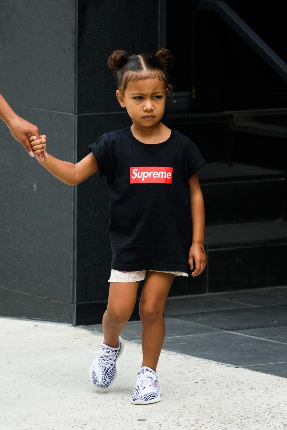 <p>Supremely cool with double buns and classic Supreme shirt, paired with her very own baby Yeezys.<br>(Photo: Splash) </p>