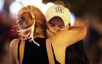 Women comfort each other during an opposition rally to protest the presidential inauguration in Minsk, Belarus, Wednesday, Sept. 23, 2020. Belarus President Alexander Lukashenko has been sworn in to his sixth term in office at an inaugural ceremony that was not announced in advance amid weeks of huge protests saying the authoritarian leader's reelection was rigged. Hundreds took to the streets in several cities in the evening to protest the inauguration. (AP Photo/TUT.by)