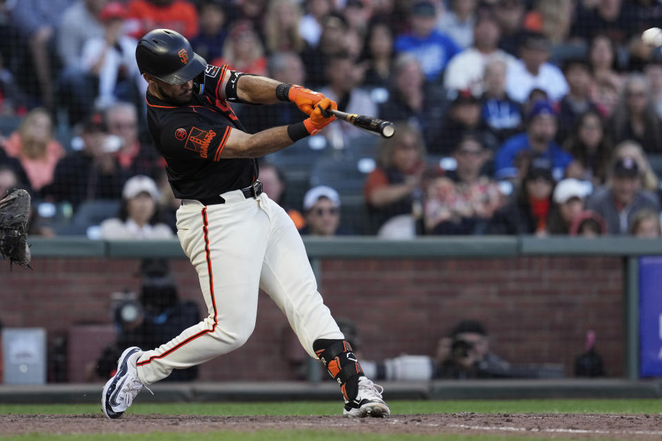 San Francisco Giants' David Villar hits an RBI double against the Los Angeles Dodgers during the 10th inning of a baseball game Saturday, June 29, 2024, in San Francisco. (AP Photo/Godofredo A. Vásquez)