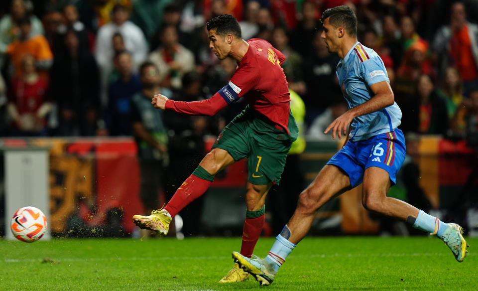 BRAGA, PORTUGAL - SEPTEMBER 27: Cristiano Ronaldo of Portugal with Rodri Hernandez of Spain in action during the UEFA Nations League - League Path Group 2 match between Portugal and Spain at Estadio Municipal de Braga on September 27, 2022 in Braga, Portugal.  (Photo by Gualter Fatia/Getty Images)