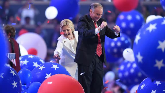 Democratic presidential candidate Hillary Clinton and vice presidential candidate Tim Kaine are surrounded by balloons at the end of the fourth and final day of the Democratic National Convention at Wells Fargo Center on July 28, 2016 in Philadelphia, Pennsylvania.   / AFP / Timothy A. CLARY        (Photo credit should read TIMOTHY A. CLARY/AFP/Getty Images)