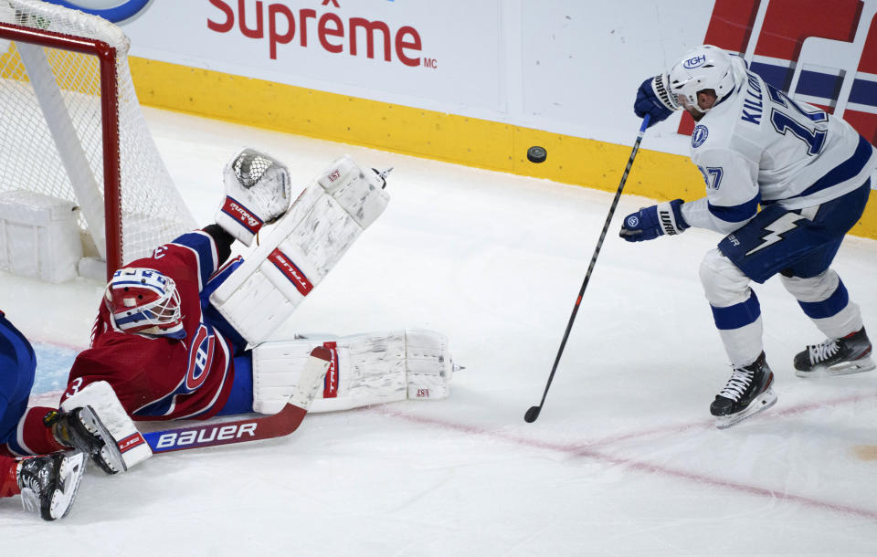 Montreal Canadiens goaltender Jake Allen makes a save on Tampa Bay Lightning's Alex Killorn during the third period of an NHL hockey game Tuesday, Dec. 7, 2021, in Montreal. (Paul Chiasson/The Canadian Press via AP)