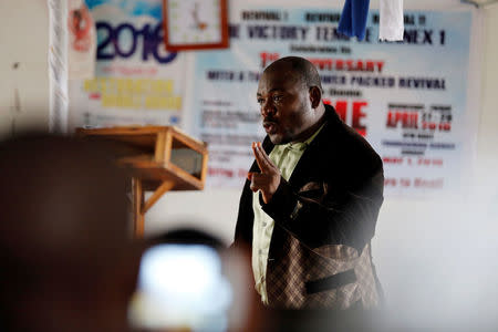 Evangelist and ex-combatant Joshua Milton Blahyi preaches in a church in his hometown of Grand Gedeh, Liberia, July 3, 2016. REUTERS/Thierry Gouegnon