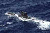 Indonesian Navy submarine KRI Nanggala sails in the waters off Tuban, East Java, Indonesia, as seen in this aerial photo taken from Indonesian Navy helicopter of 400 Air Squadron, in this Monday, Oct. 6, 2014 photo. Indonesia's navy is searching for the submarine that went missing north of the resort island of Bali with a number of people on board, the military said Wednesday. (AP Photo/Eric Ireng)