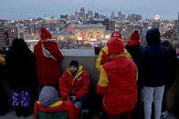 People gather at the Liberty Memorial as they wait for a parade through downtown Kansas City, Mo. to celebrate the Kansas City Chiefs victory in NFL's Super Bowl 54 Wednesday, Feb. 5, 2020. (AP Photo/Charlie Riedel)