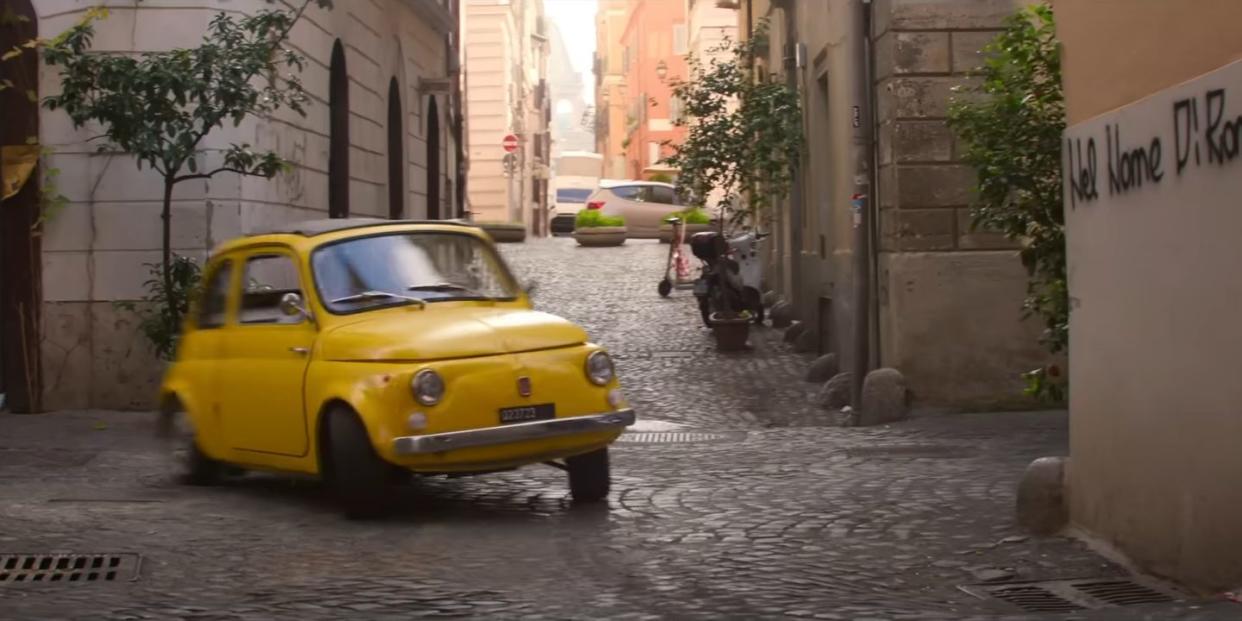 a yellow fiat 500 drifts over cobblestones in mission impossible dead reckoning part 1