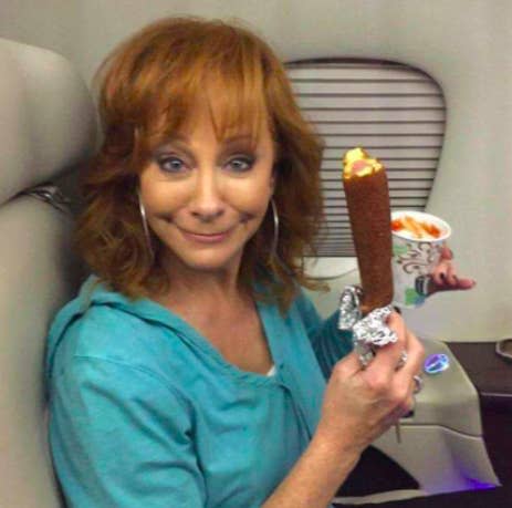 Reba looking happy with a corndog