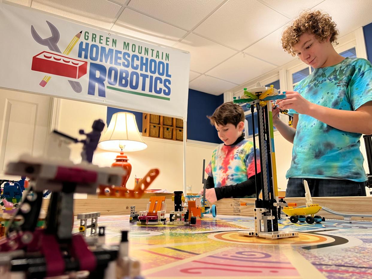 J.J. Garcia, 10, of Williston, and Ted Agnew, 12, of Jericho, perfect their robot on Feb. 2, 2024. The two members of the Green Mountain Homeschool Robotics team were preparing to represent Vermont in the middle school bracket of the world LEGO Robotics championship in April.