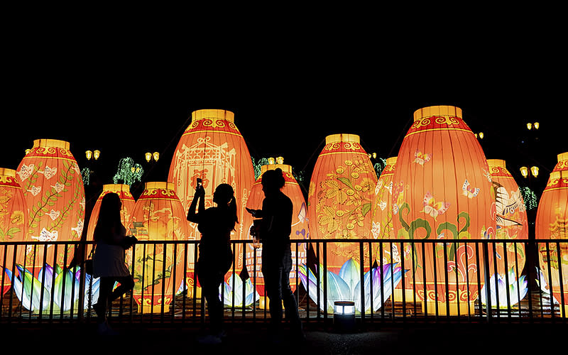 A woman takes a photo during the Chinese Lantern Festival in Santiago, Chile, on Jan. 4. <em>Associated Press/Matias Basualdo</em>