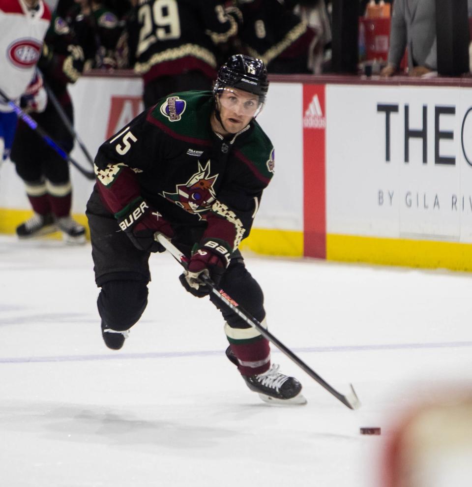 Arizona Coyotes center Alex Kerfoot (15) skates with the puck at Mullett Arena in Tempe on Nov. 2, 2023.