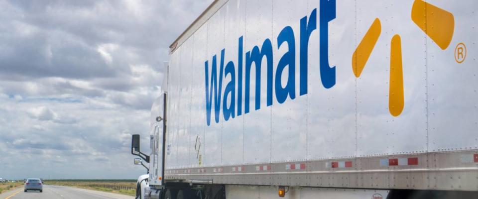 Walmart truck driving on the interstate on a cloudy day